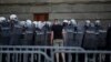 A protester remonstrates with police during violent demonstrations in Belgrade on July 8. 